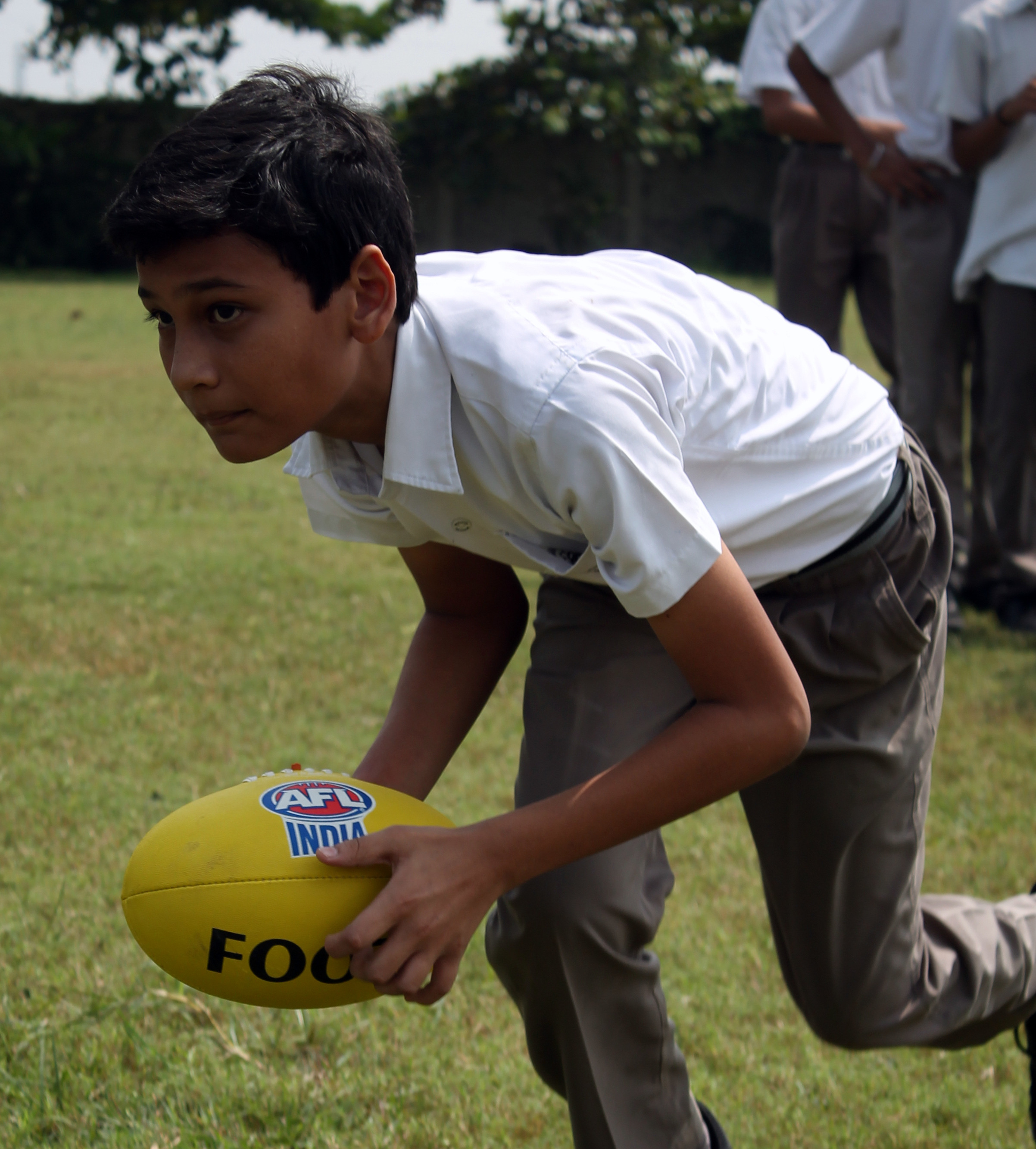 A student of Bhavan's Raipur playing Footy